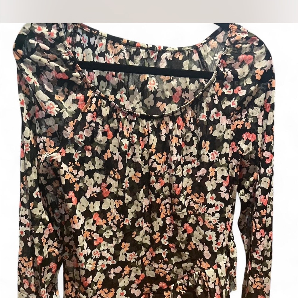 Woman’s Long Sleeve Sheer Top in size M